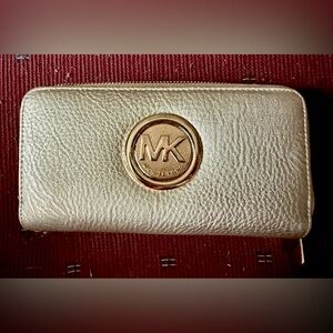 MK Pebbled Leather Gold Double Zippered wallet.  7.5” X 4” X  1” thick.